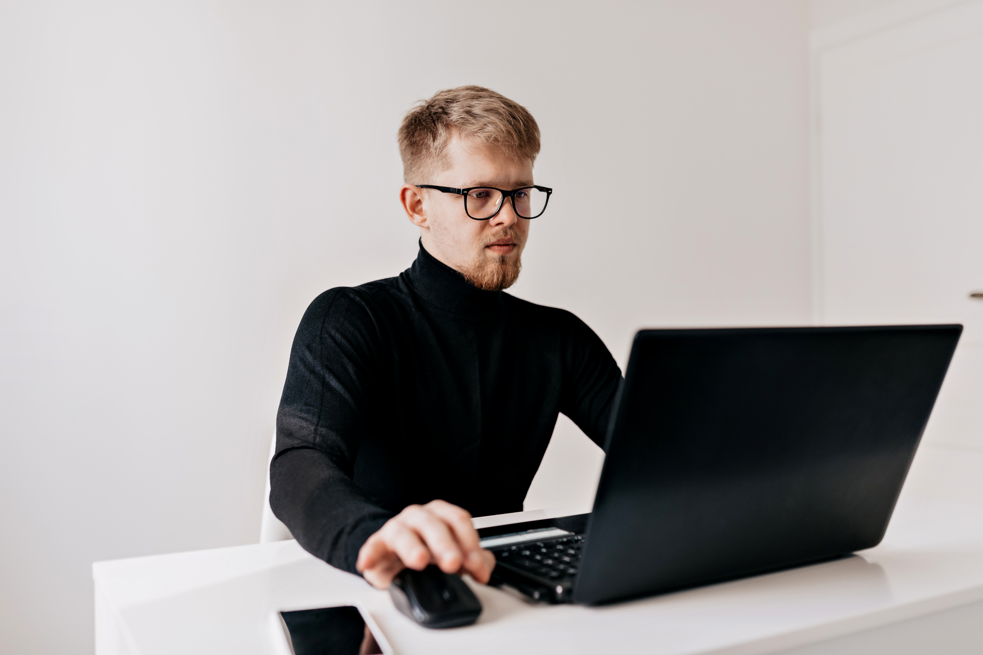 Stock image фрилансеры. Young man with Laptop. Computer man. Man on his Desk working ai.